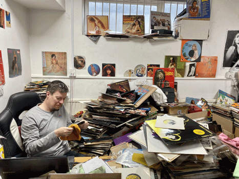 Mike cleaning records. The ones behind him are not good enough to sell